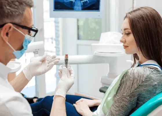 Dentist explaining dental implant treatment to a patient